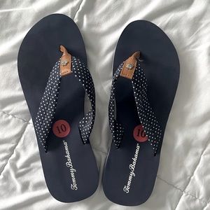 Gently used Tommy Bahama navy flip flops in size 10
